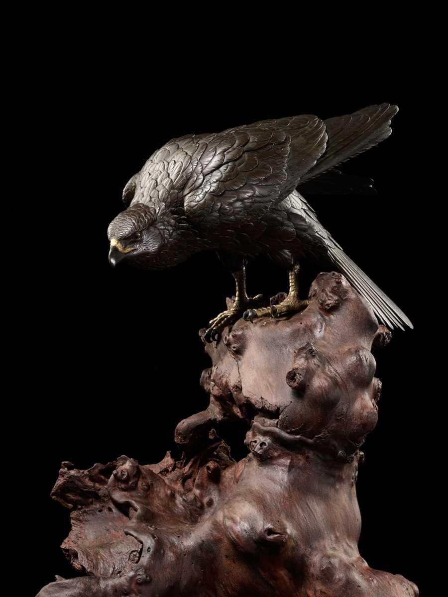 Lot 115 - MASATSUNE: A SUPERB AND LARGE BRONZE OKIMONO OF A HAWK ON ROOTWOOD BASE