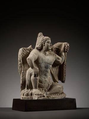 Lot 181 - A GRAY SCHIST FIGURE OF A WINGED ATLAS, ANCIENT REGION OF GANDHARA, 3RD - 4TH CENTURY