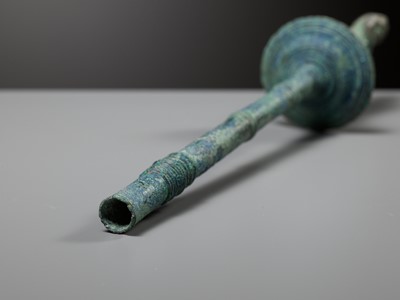 Lot 279 - A KHMER BRONZE FITTING WITH A FIGURE OF A FEMALE DEITY, ANGKOR PERIOD