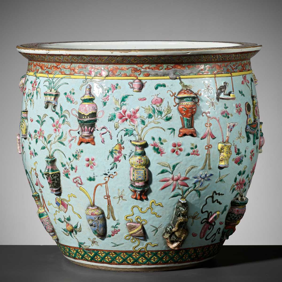 Lot 114 - A LARGE FAMILLE ROSE RELIEF-MOLDED FISHBOWL, QING DYNASTY
