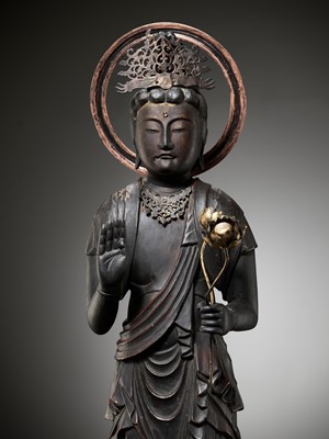 Lot 37 - A GILT AND LACQUERED WOOD FIGURE OF KANNON BOSATSU HOLDING LOTUS BLOSSOMS