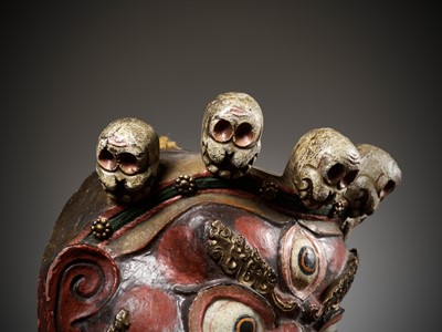Lot 526 - A POLYCHROME AND GILT-LACQUERED PAPIER-MÂCHÉ RITUAL MASK FOR THE CHAM DANCE