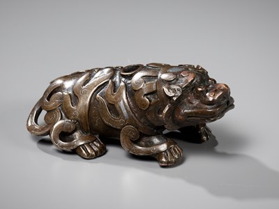 Lot 488 - A SILVER-INLAID BRONZE ‘BUDDHIST LION’ WATERDROPPER, 17TH-18TH CENTURY