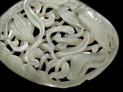 Lot 322 - A CELADON JADE ‘CRANE AND LOTUS’ PLAQUE, YUAN TO MING DYNASTY
