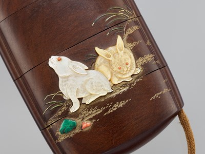 AN EXQUISITE INLAID WOOD THREE-CASE INRO DEPICTING RABBITS