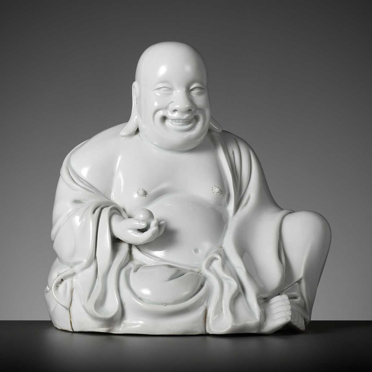 Lot 404 - A RARE WHITE GLAZED FIGURE OF A SEATED BUDAI, DEHUA, SIGNED XU YOUYI (CHINA 1887-1940)