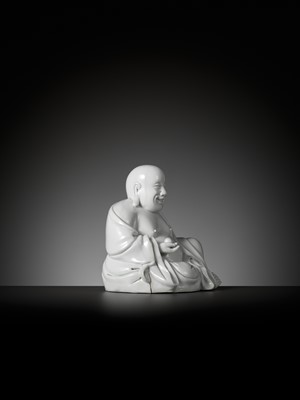 Lot 404 - A RARE WHITE GLAZED FIGURE OF A SEATED BUDAI, DEHUA, SIGNED XU YOUYI (CHINA 1887-1940)