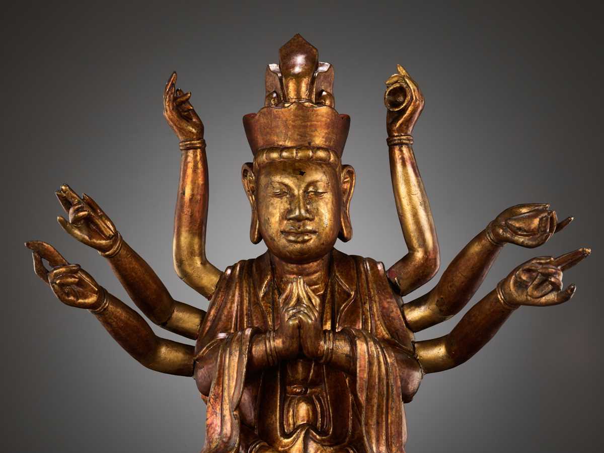Lot 617 - A LARGE GILT-LACQUERED WOOD FIGURE OF AVALOKITESHVARA, VIETNAM, 18TH-19TH CENTURY