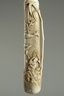 Lot 535 - A STAG ANTLER KISERUZUTSU WITH A BOY AND TURTLE, MEIJI