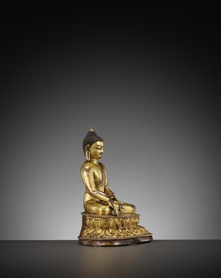 Lot 516 - A BRONZE FIGURE OF BUDDHA SHAKYAMUNI, TIBET, 15TH CENTURY