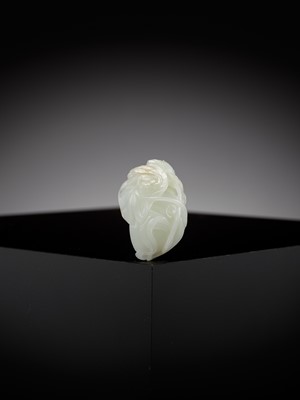 Lot 40 - A WHITE JADE ‘LOTUS AND BEETLE’ PENDANT, 18TH CENTURY