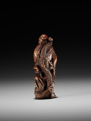 AN EXCEPTIONAL AND RARE WOOD NETSUKE OF RYO TOHIN TAUNTING A DRAGON