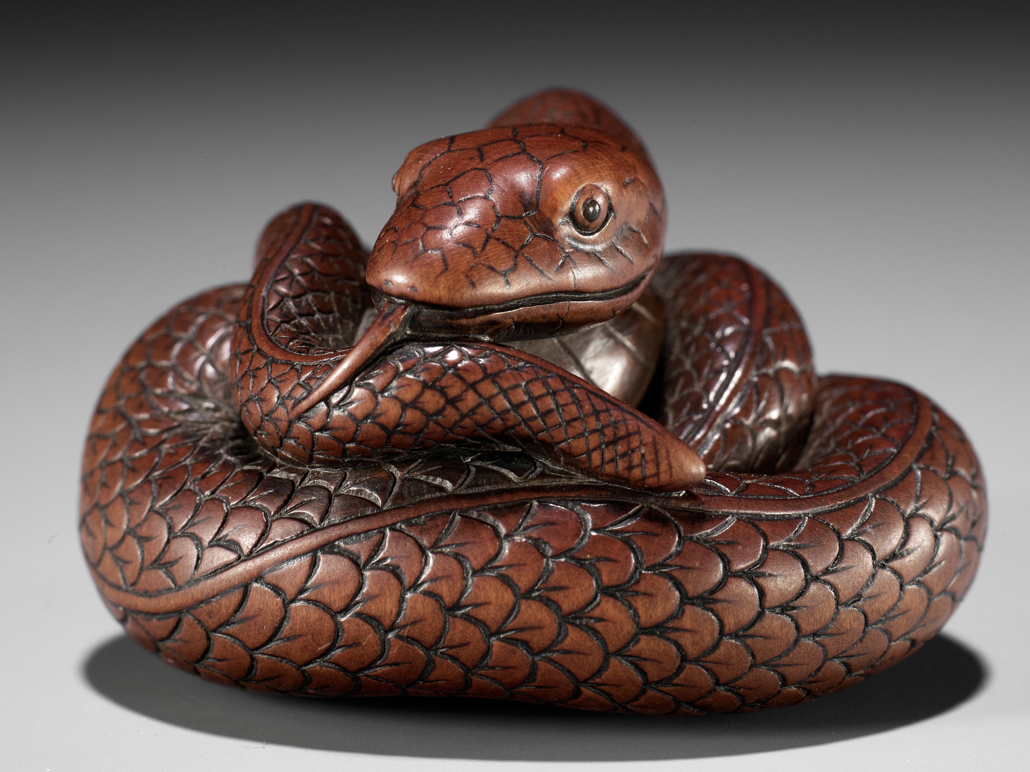 Lot 36 - AN EXCEPTIONAL AND LARGE WOOD NETSUKE OF A