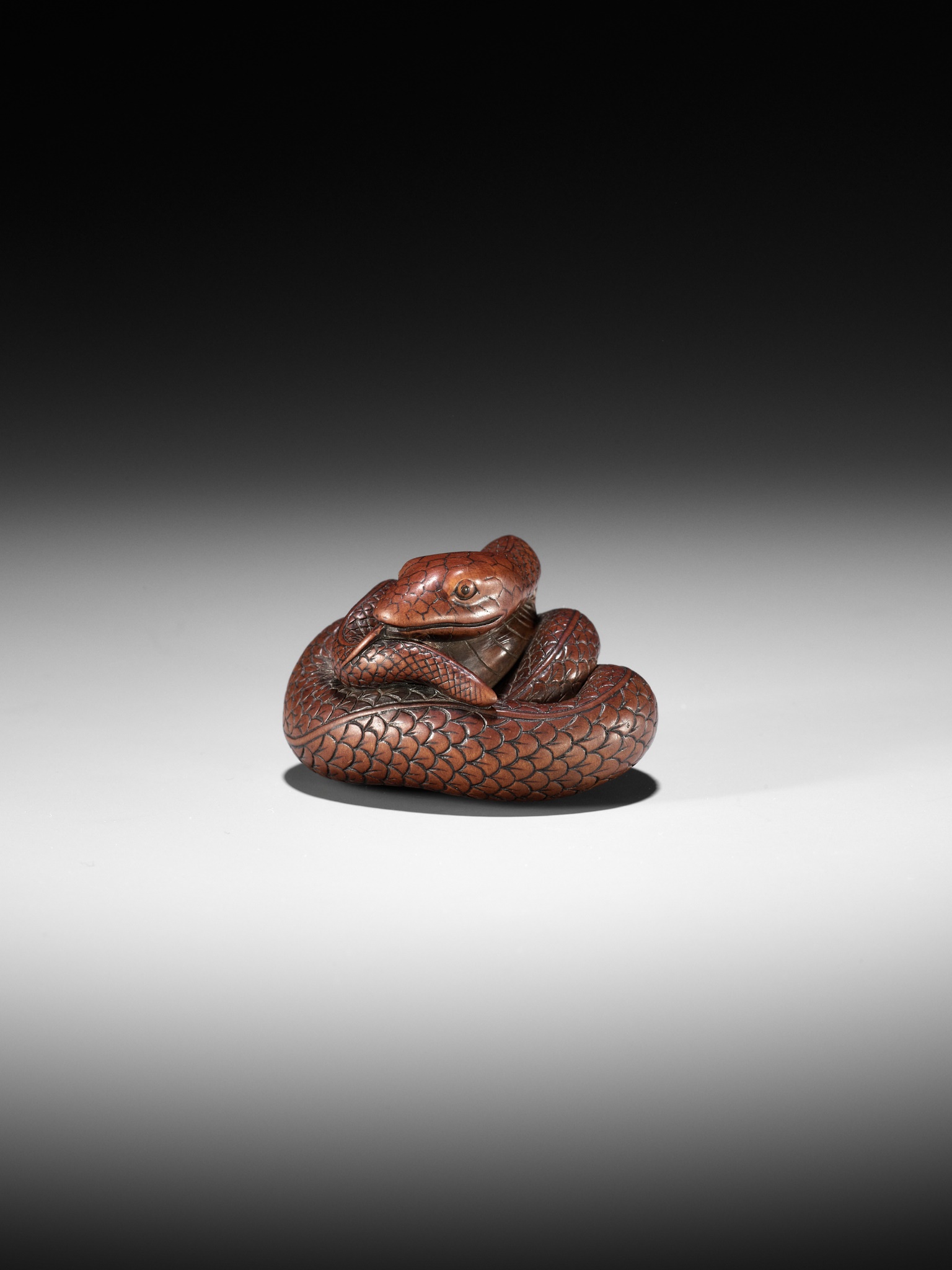 Lot 36 - AN EXCEPTIONAL AND LARGE WOOD NETSUKE OF A