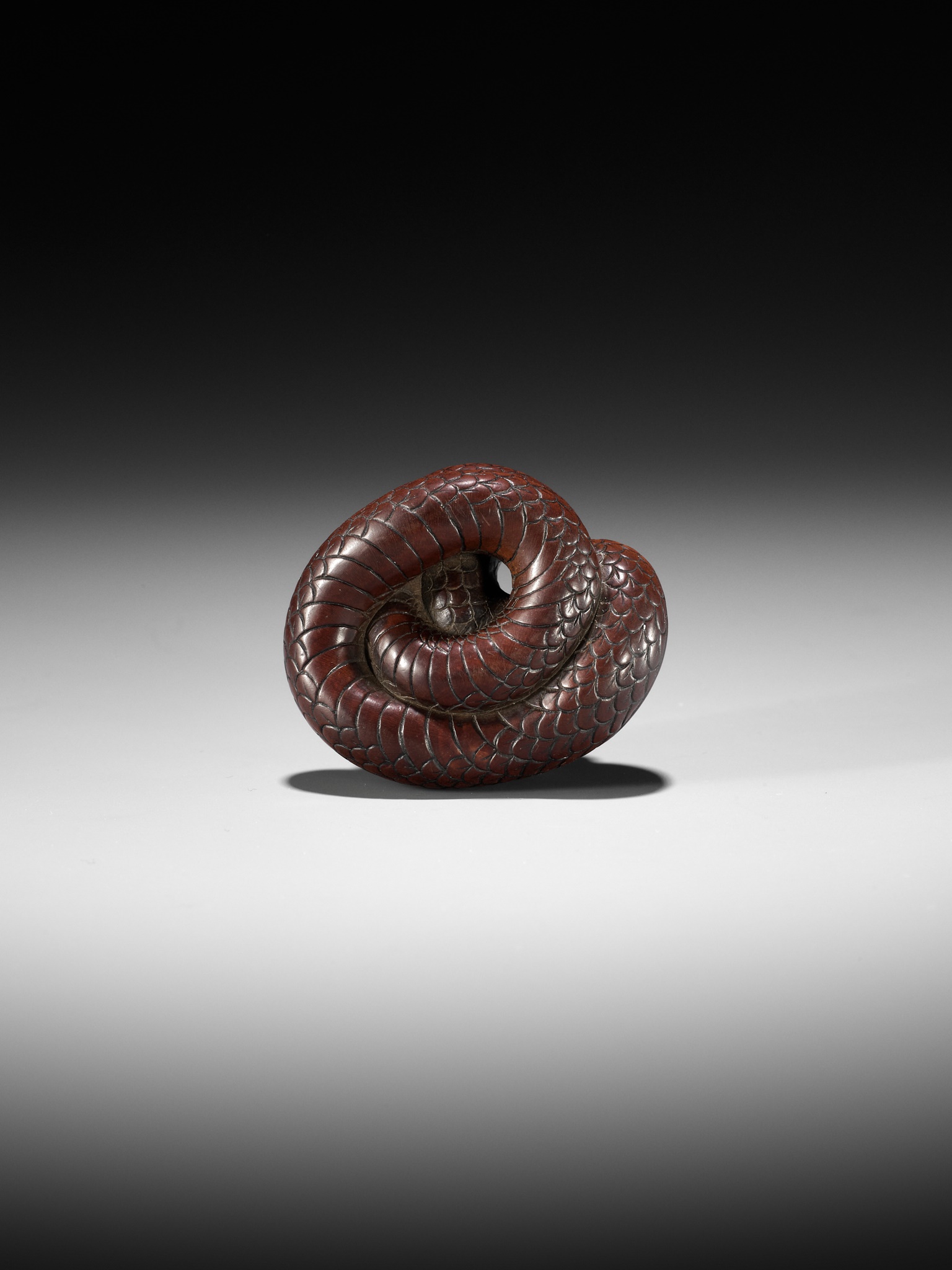 Lot 36 - AN EXCEPTIONAL AND LARGE WOOD NETSUKE OF A