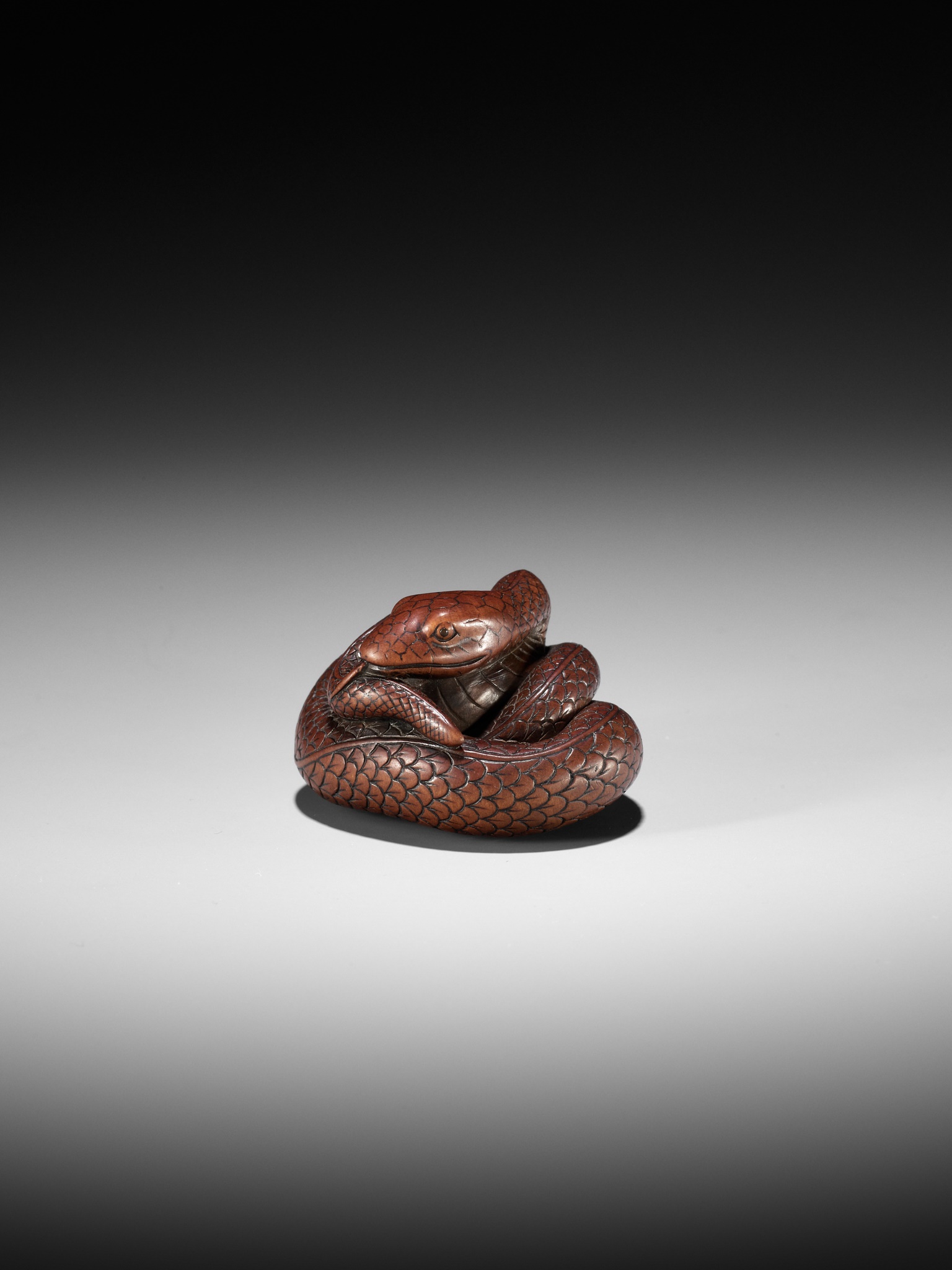 Lot 36 - AN EXCEPTIONAL AND LARGE WOOD NETSUKE OF A