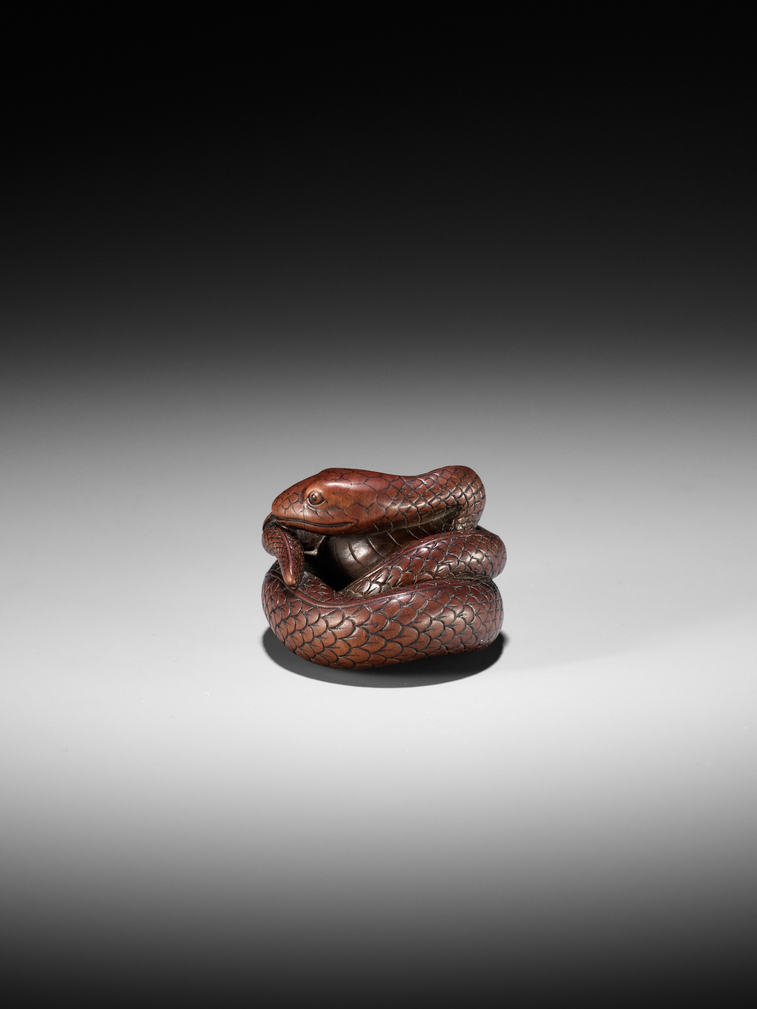 Lot 36 - AN EXCEPTIONAL AND LARGE WOOD NETSUKE OF A