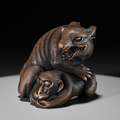 Lot 570 - A LARGE AND FINE YAMADA SCHOOL WOOD OKIMONO NETSUKE OF A WOLF AND MONKEY