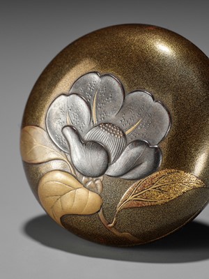 A VERY FINE LACQUER MANJU NETSUKE WITH BLOSSOMING UME (PLUM)