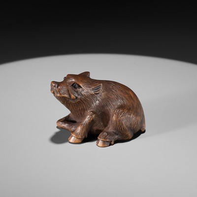 Lot 664 - A WOOD NETSUKE OF A RECUMBENT BOAR, INSCRIBED MASANAO