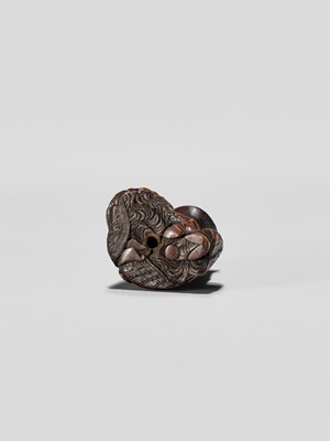 Lot 371 - HIDEHARU: A NAGOYA SCHOOL WOOD NETSUKE OF A DRUNKEN SHOJO WITH LADLE AND SAKE SAUCER