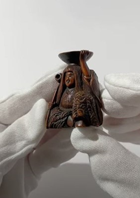 Lot 371 - HIDEHARU: A NAGOYA SCHOOL WOOD NETSUKE OF A DRUNKEN SHOJO WITH LADLE AND SAKE SAUCER