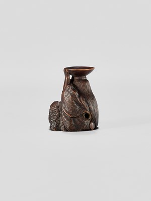 Lot 371 - HIDEHARU: A NAGOYA SCHOOL WOOD NETSUKE OF A DRUNKEN SHOJO WITH LADLE AND SAKE SAUCER