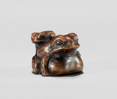 A WOOD NETSUKE OF A TOAD WITH YOUNG, INSCRIBED MASANAO