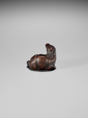 Lot 324 - MASAMARU: A FINE WOOD NETSUKE OF A RECUMBENT HORSE
