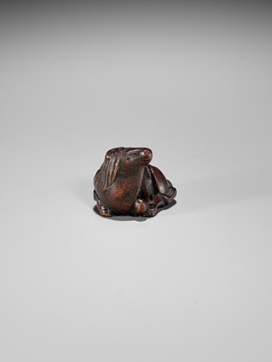 Lot 324 - MASAMARU: A FINE WOOD NETSUKE OF A RECUMBENT HORSE