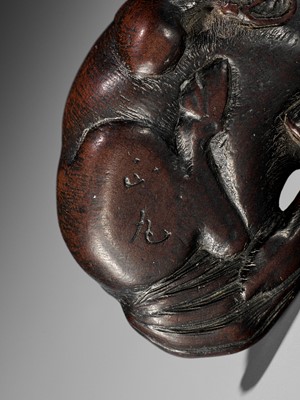Lot 324 - MASAMARU: A FINE WOOD NETSUKE OF A RECUMBENT HORSE
