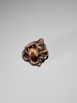 Lot 96 - A SUPERB WOOD NETSUKE OF AN AMA STRUGGLING WITH AN OCTOPUS, ATTRIBUTED TO IKKYU