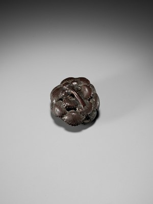 Lot 208 - A RARE TOKYO SCHOOL COROZO NUT AND STAG ANTLER NETSUKE OF A FROG INSIDE A CHRYSANTHEMUM