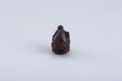 Lot 380 - INTERIOR OF A WOOD KARAKURI NETSUKE WITH TWO IMMORTALS PLAYING SUGOROKU, EDO PERIOD
