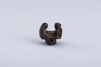 Lot 380 - INTERIOR OF A WOOD KARAKURI NETSUKE WITH TWO IMMORTALS PLAYING SUGOROKU, EDO PERIOD