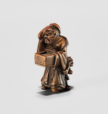 Lot 883 - HIDEKAZU: A WOOD NETSUKE OF SHOKI AND ONI AT SETSUBUN