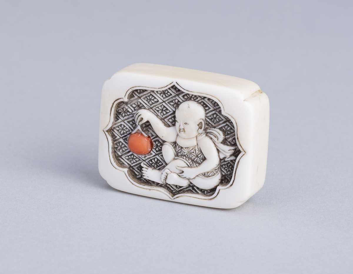 Lot 376 - RENSAI: AN INLAID IVORY MANJU-STYLE NETSUKE DEPICTING A BOY, 19th CENTURY