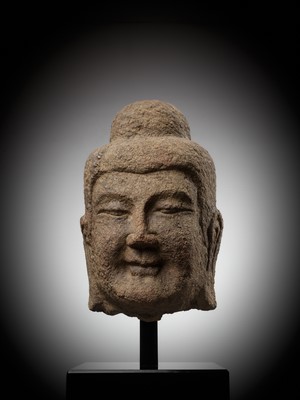 Lot 182 - A MONUMENTAL SANDSTONE HEAD OF BUDDHA, NORTHERN WEI DYNASTY, CHINA, 386-534