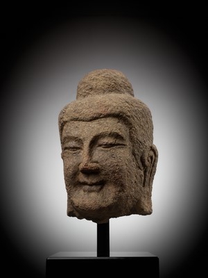 Lot 182 - A MONUMENTAL SANDSTONE HEAD OF BUDDHA, NORTHERN WEI DYNASTY, CHINA, 386-534