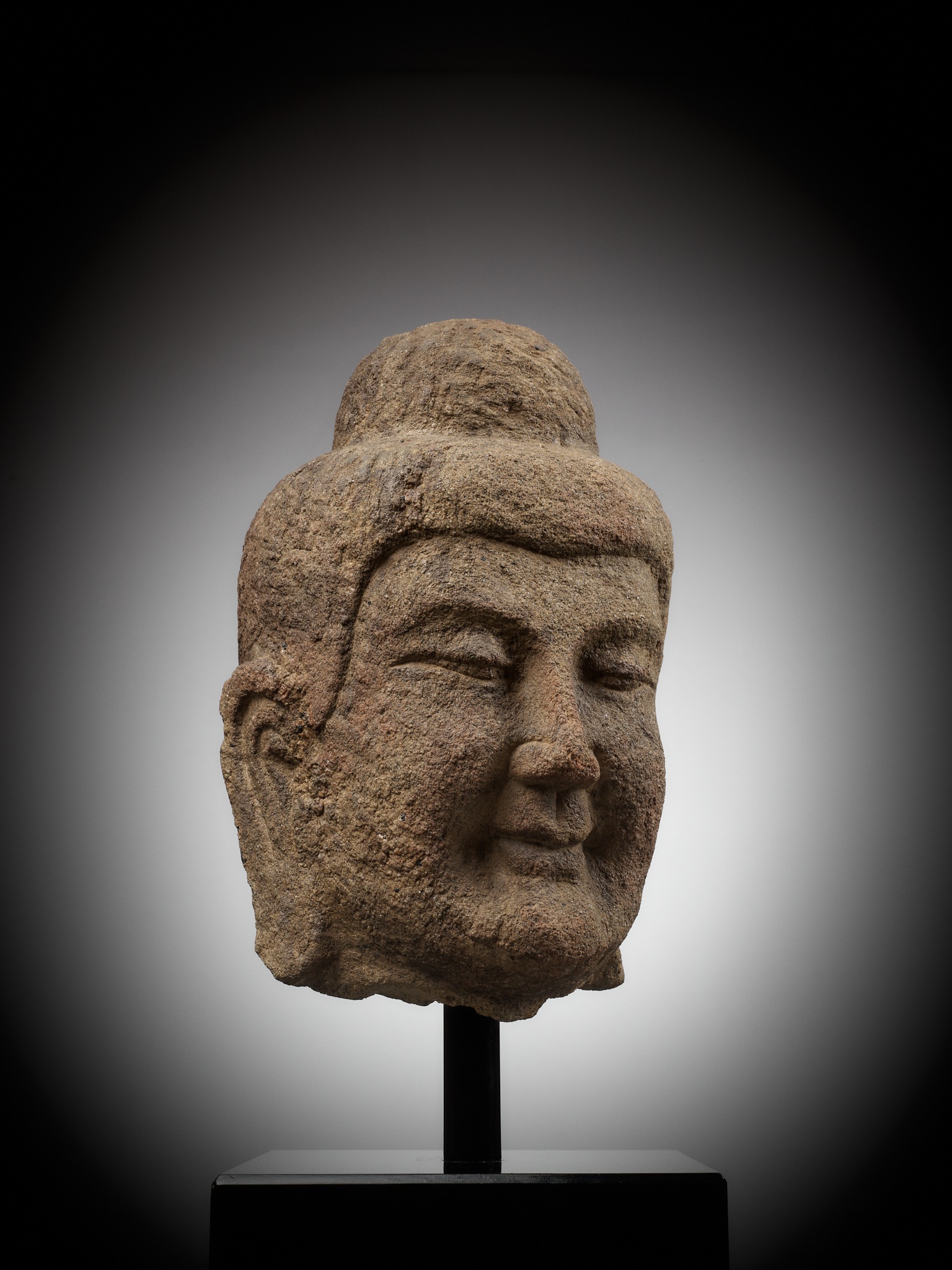 Lot 182 - A MONUMENTAL SANDSTONE HEAD OF BUDDHA,