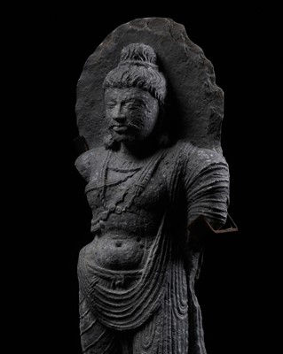 Lot 245 - A GRAY SCHIST FIGURE OF MAITREYA, ANCIENT REGION OF GANDHARA