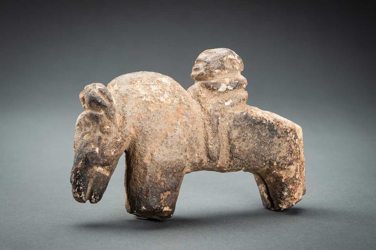Lot 527 - AN ANCIENT FIGURE OF A HORSE RIDER