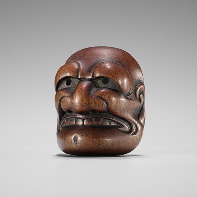 Lot 835 - TADATOSHI: A FINE NAGOYA SCHOOL WOOD MASK NETSUKE OF BUAKU