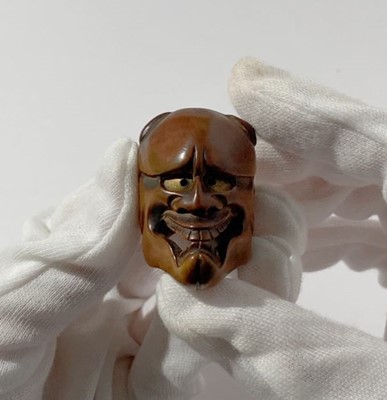 Lot 430 - DEME UMAN: A WOOD MASK NETSUKE OF KIJO