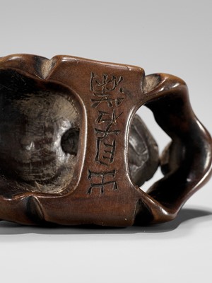 Lot 430 - DEME UMAN: A WOOD MASK NETSUKE OF KIJO