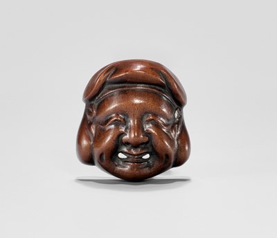 Lot 844 - A WOOD MASK NETSUKE OF DAIKOKU, EDO PERIOD