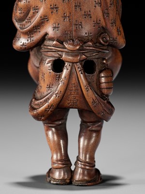 Lot 216 - OUCHI GYOKUSO: A VERY FINE SO SCHOOL WOOD NETSUKE OF A TEMPLE SERVANT WITH MOKUGYO