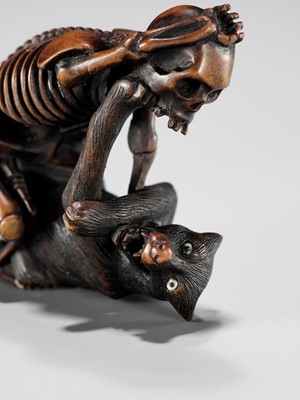 Lot 347 - A FINE WOOD NETSUKE OF A WOLF AND SKELETON, ATTRIBUTED TO SHOKO
