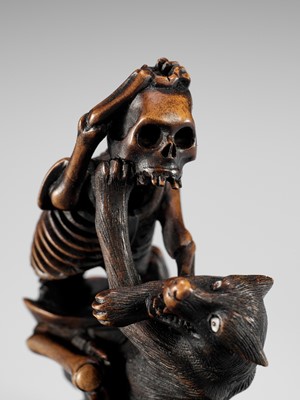 Lot 347 - A FINE WOOD NETSUKE OF A WOLF AND SKELETON, ATTRIBUTED TO SHOKO