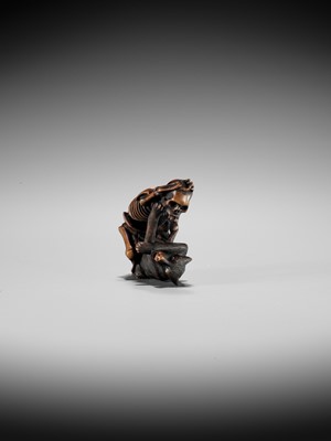 Lot 347 - A FINE WOOD NETSUKE OF A WOLF AND SKELETON, ATTRIBUTED TO SHOKO